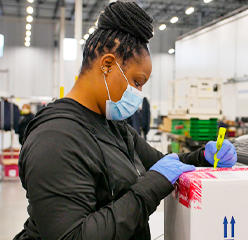 woman shipping vaccines box