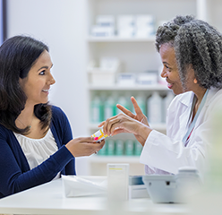 Pharmacist helping patient