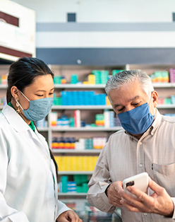 Pharmacist helping patient